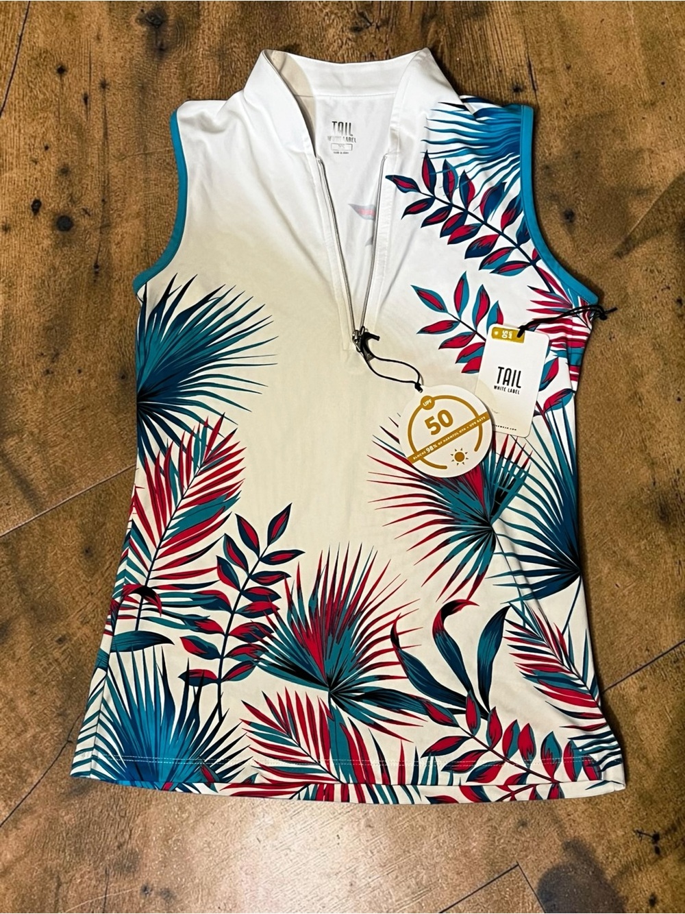 TAIL Activewear Women’s White Tropical Print Sleeveless Polo
